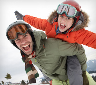 Young Father And Son On Winter Vacation